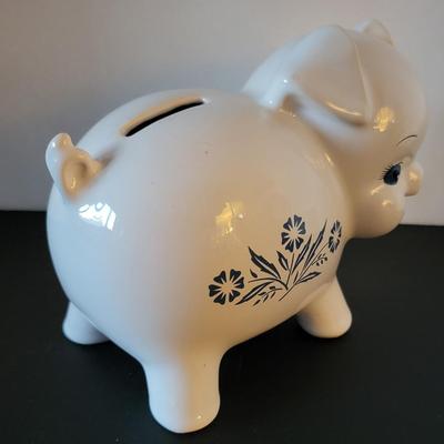 Sale Photo Thumbnail #520: Vintage 1980's Cornflower Blue Piggy Bank England (has a crack but may be from age as pictured)
6 3/4" long 
4 3/4" tall