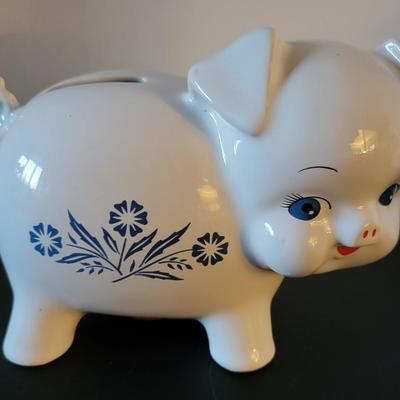 Sale Photo Thumbnail #514: Vintage 1980's Cornflower Blue Piggy Bank England (has a crack but may be from age as pictured)
6 3/4" long 
4 3/4" tall