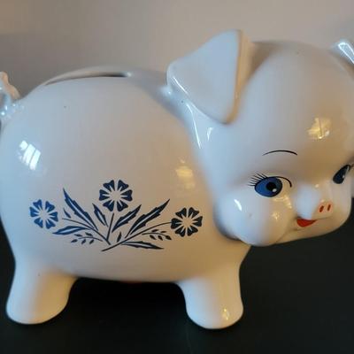 Sale Photo Thumbnail #524: Vintage 1980's Cornflower Blue Piggy Bank England (has a crack but may be from age as pictured)
6 3/4" long 
4 3/4" tall