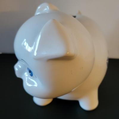 Sale Photo Thumbnail #516: Vintage 1980's Cornflower Blue Piggy Bank England (has a crack but may be from age as pictured)
6 3/4" long 
4 3/4" tall