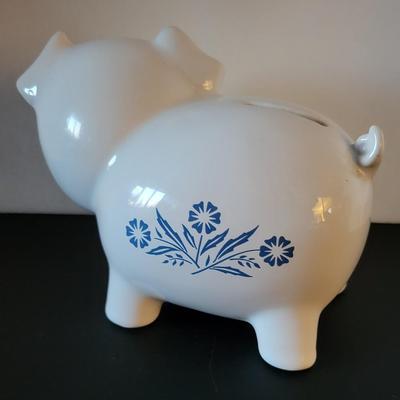 Sale Photo Thumbnail #518: Vintage 1980's Cornflower Blue Piggy Bank England (has a crack but may be from age as pictured)
6 3/4" long 
4 3/4" tall