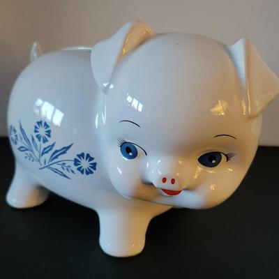 Sale Photo Thumbnail #515: Vintage 1980's Cornflower Blue Piggy Bank England (has a crack but may be from age as pictured)
6 3/4" long 
4 3/4" tall