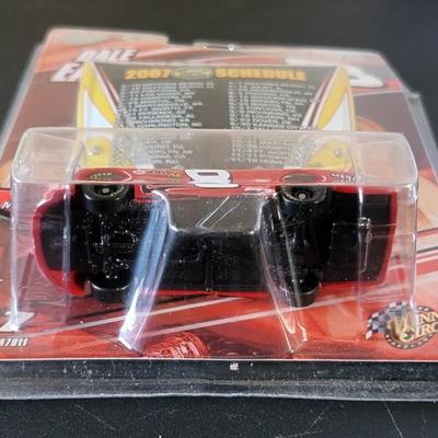 Sale Photo Thumbnail #775: Dale Earnhardt Jr Winners Circle & Ricky Rudd Racing Champions (package is warped as pictured)