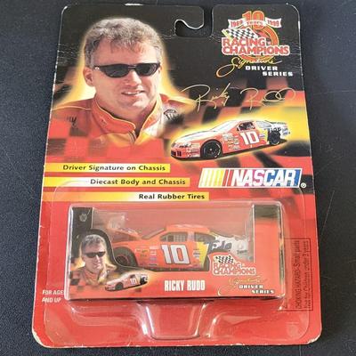 Sale Photo Thumbnail #777: Dale Earnhardt Jr Winners Circle & Ricky Rudd Racing Champions (package is warped as pictured)