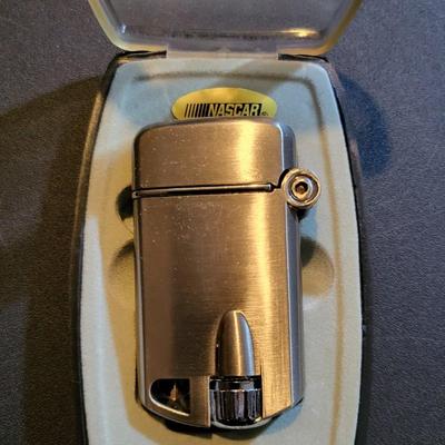 Sale Photo Thumbnail #869: Dale Earnhardt Lighter & Rookie of the Year Knife (package has cut as pictured, unopened)