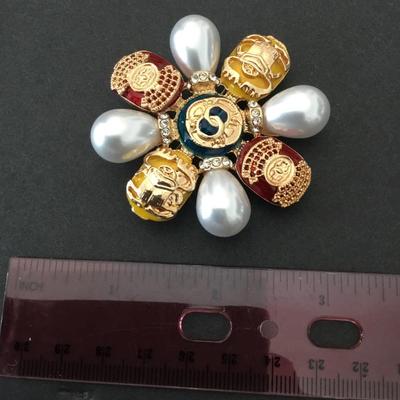 Large gold tone, bow, pearl brooch