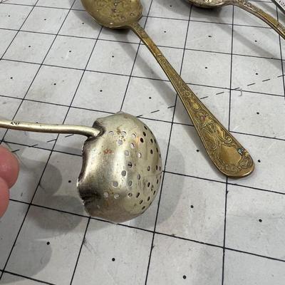 5 interesting Brass and Silver Spoons  