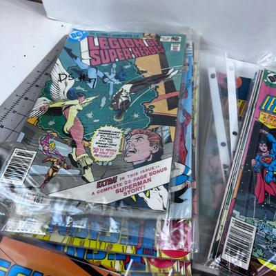 Lots of Comics: Justice League, Super Man, Super Women, etc. 