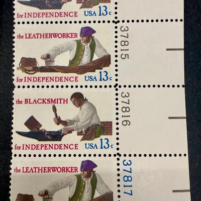 Sale Photo Thumbnail #65: Mint condition plate blocks of the 1977 US 13-cent Skilled Hands for Independence commemorative stamps (Scott #1717-1720). Issued on July 4, 1977, in Cincinnati, Ohio, the stamps honor the essential civilian tradespeople who supported the American Revolut