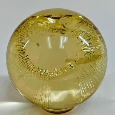 Sale Photo Thumbnail #16: Ring-shaped stand on the bottom, yellow-tinted acrylic material. Approx. 3.5" across, about the size of a baseball.