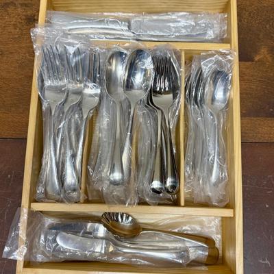Sale Photo Thumbnail #90: In mostly unused condition and still in their packages. Qty: 5 Serving Pieces, 12 small forks, 12 big forks, 11 small spoons (missing 1) , 12 big spoons, land 12 knives.