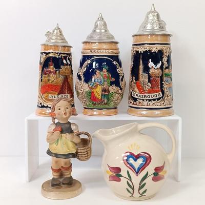 LOT 66: Goebel Hummel Sister Figurine, Shawnee Pennsylvania Dutch Creamer & German Made Steins