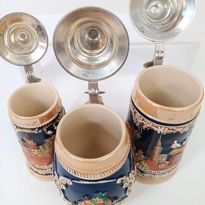 LOT 66: Goebel Hummel Sister Figurine, Shawnee Pennsylvania Dutch Creamer & German Made Steins