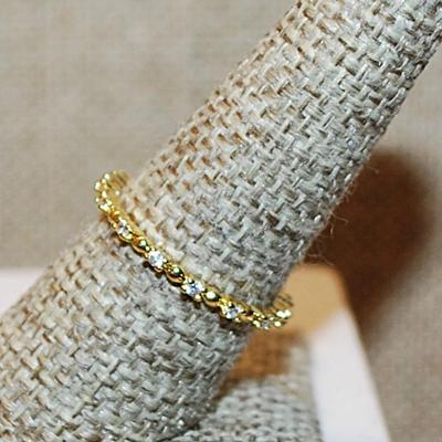 Size 8 Delicate All Infinity Styled Ring with Tiny Round Clear Stones Separated by Half Globe Accents on a Gold Tone Band (1.3g)