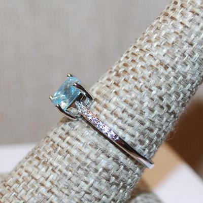Size 8¼ Transparent Light Blue Stone Asscher Cut Ring 4 Prong with Side Accents on a Silver Tone Band (1.8g)