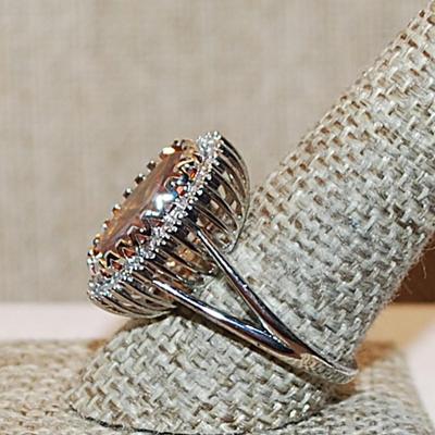 Size 10½ Marked .925 Large ORANGE AMBER Oval Stone with Nested Full Surround on a Silver Band (8.7g)