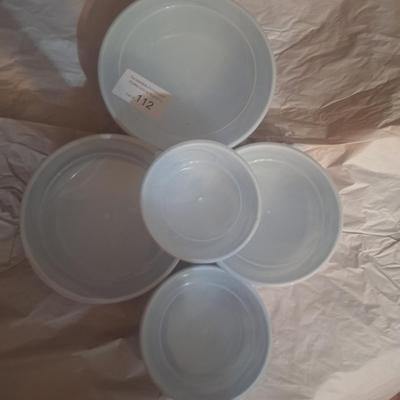 5-piece set of enamel storage bowls with lids, featuring a floral pattern.