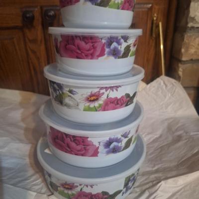 5-piece set of enamel storage bowls with lids, featuring a floral pattern.