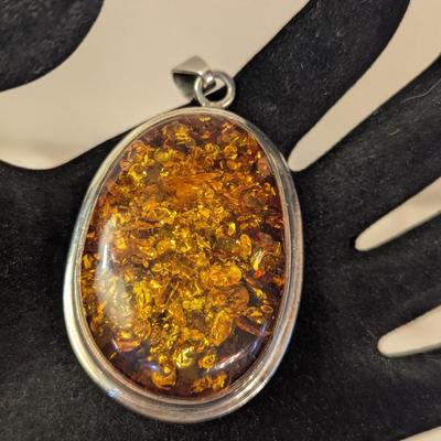 Large oval baltic amber pendant in silver- no markings
