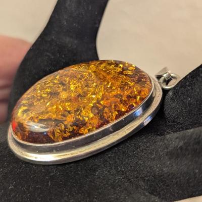 Large oval baltic amber pendant in silver- no markings