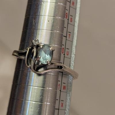 Sterling silver ring with lue topaz and diamond or cz accents