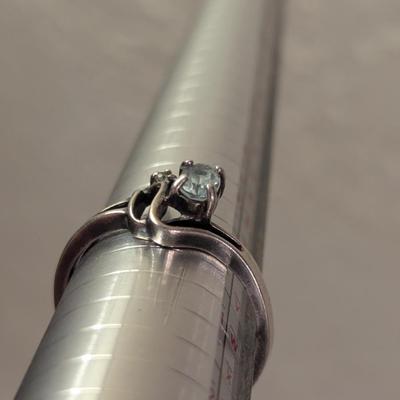 Sterling silver ring with lue topaz and diamond or cz accents