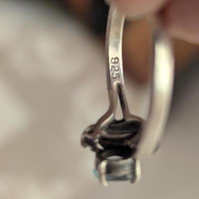 Sterling silver ring with lue topaz and diamond or cz accents