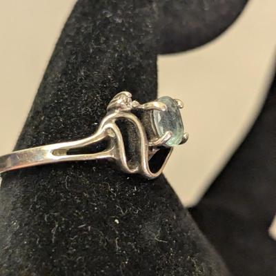 Sterling silver ring with lue topaz and diamond or cz accents