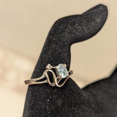 Sterling silver ring with lue topaz and diamond or cz accents