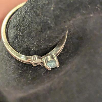 Sterling silver ring with lue topaz and diamond or cz accents