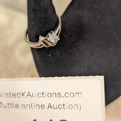 Sterling silver ring with lue topaz and diamond or cz accents