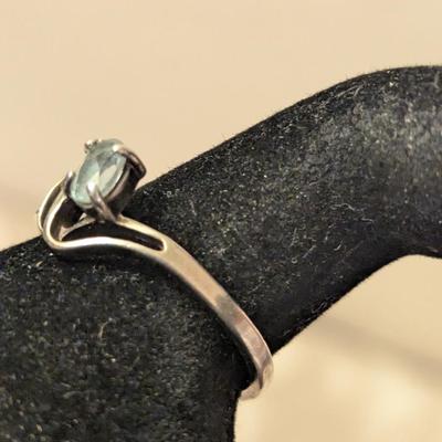 Sterling silver ring with lue topaz and diamond or cz accents