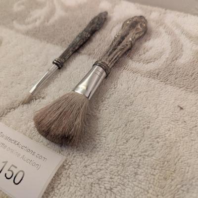 vintage silver makeup brushes.
