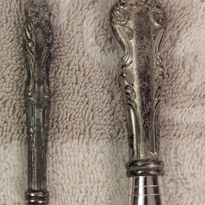 vintage silver makeup brushes.
