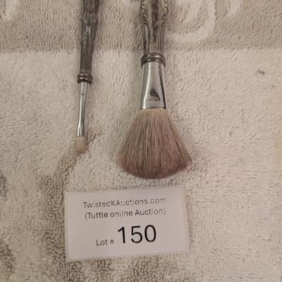 vintage silver makeup brushes.