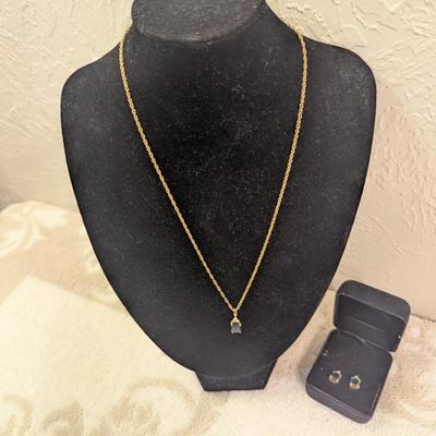 necklace and earrings set with green stones