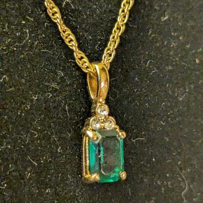 necklace and earrings set with green stones