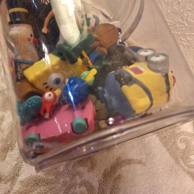 acrylic or plastic closing canister full of pocket size toys