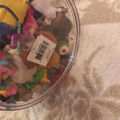 acrylic or plastic closing canister full of pocket size toys