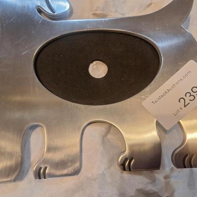 dog-shaped photo frame made from stainless steel or a similar silver-finish metal.