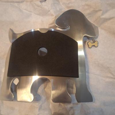 dog-shaped photo frame made from stainless steel or a similar silver-finish metal.
