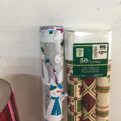 Lot of christmas wrap, wrapping paper. 