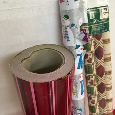 Lot of christmas wrap, wrapping paper. 