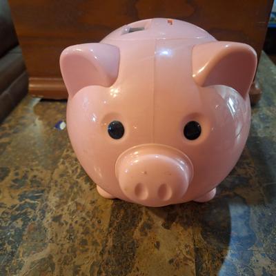 pink plastic piggy bank- counts coins