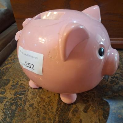 pink plastic piggy bank- counts coins