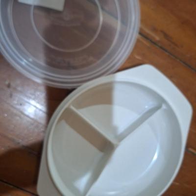 plastic, three-compartment food storage container with a lid. Microwave safe