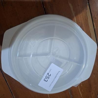 plastic, three-compartment food storage container with a lid. Microwave safe