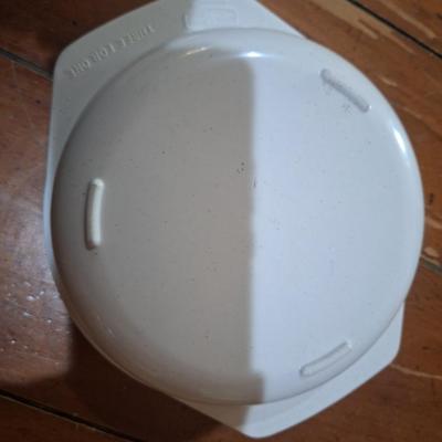 plastic, three-compartment food storage container with a lid. Microwave safe