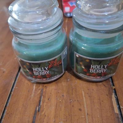 set of silver-plated tealight candle holders with glass shades. And two small glass jar candles