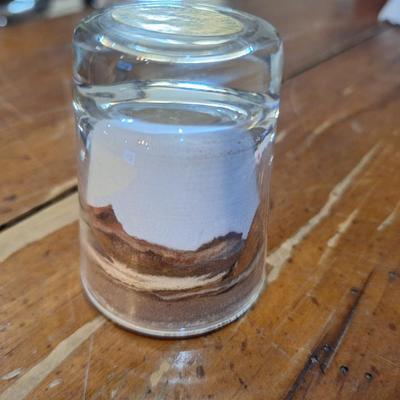 Native American "Painted Desert Sands" sand art shot glass.